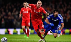 Chelsea's Diego Costa is brought down by Liverpool's Martin Skrtel in the Capital One Cup semi-final